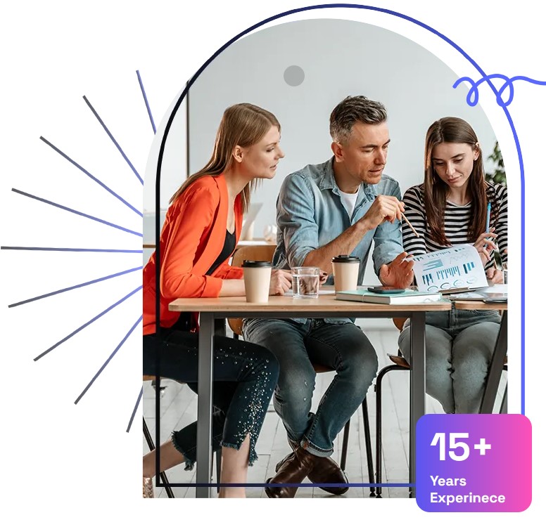 A team reviewing a report together, with a fifteen years experience badge